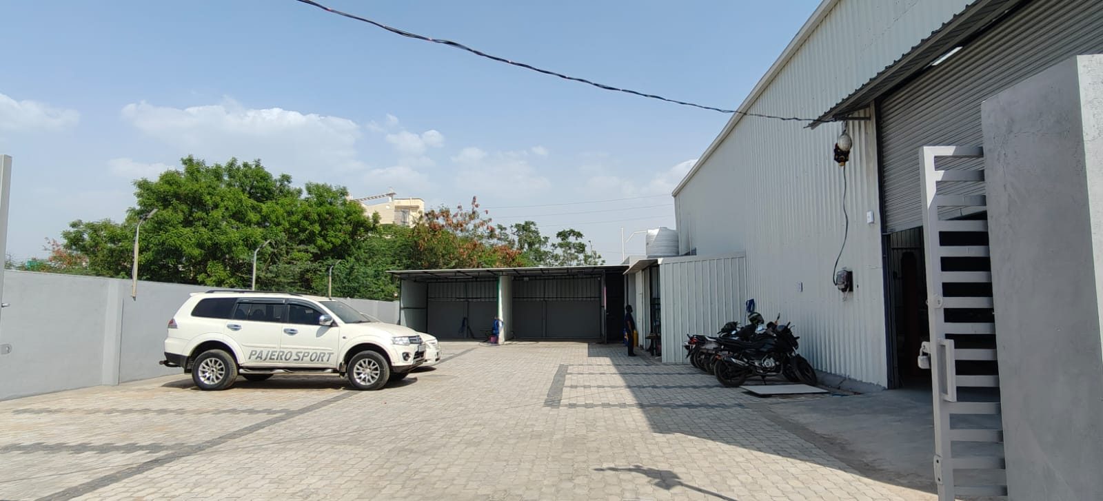 Torque Experts workshop exterior with customer car at Madhapur, Hyderabad